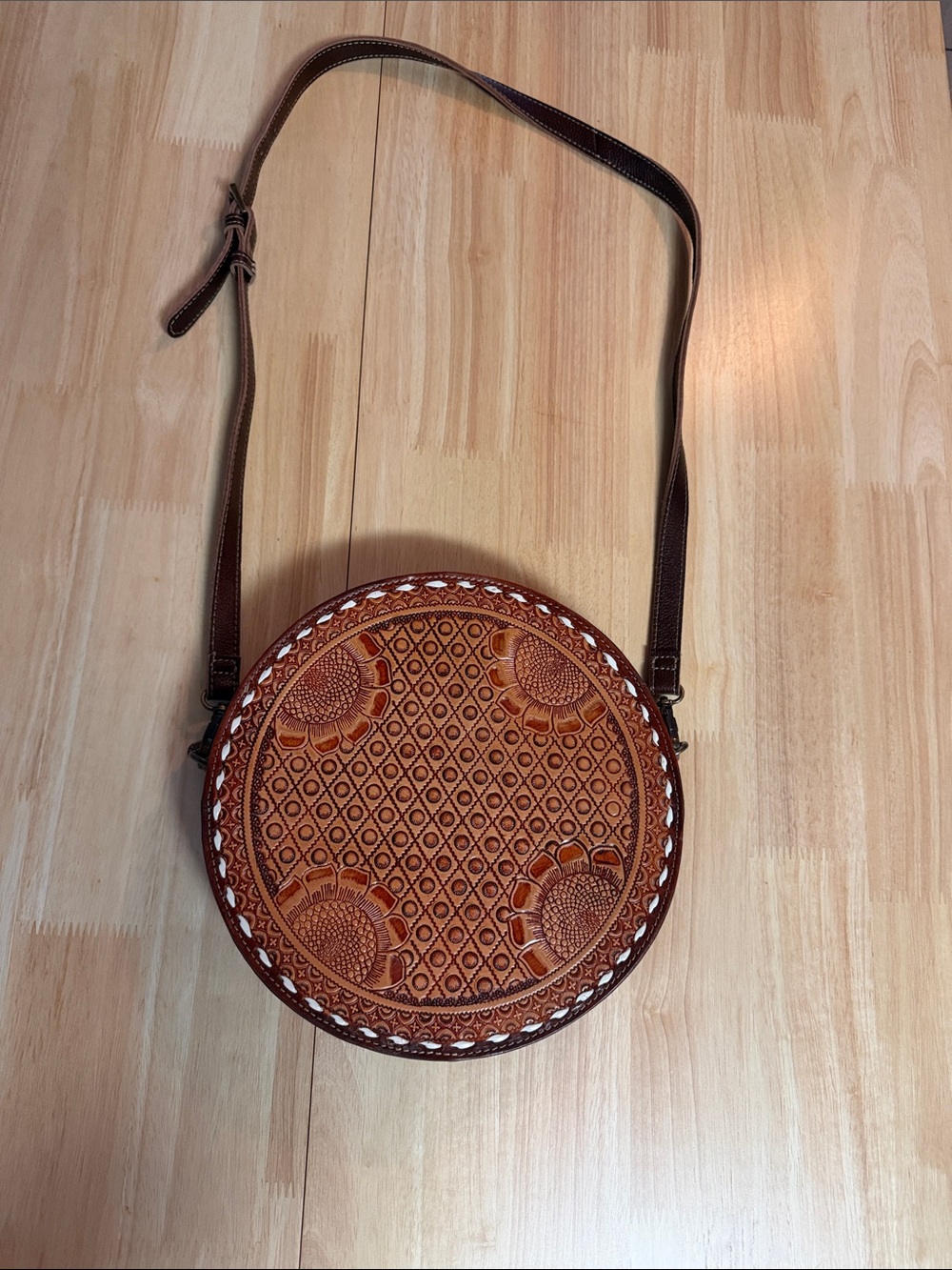 Round Embossed Leather Crossbody Bag in Brown